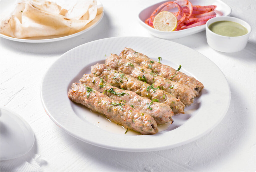 Delicious chicken kebabs with onion and mint chutney